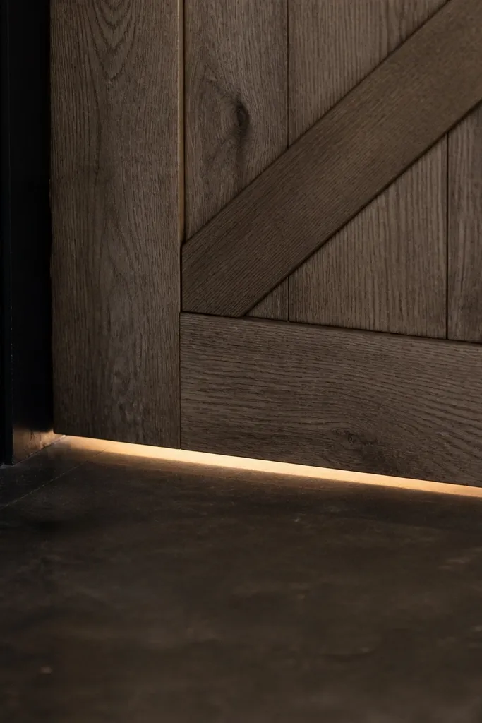 Gap under barn door showing light and drafts