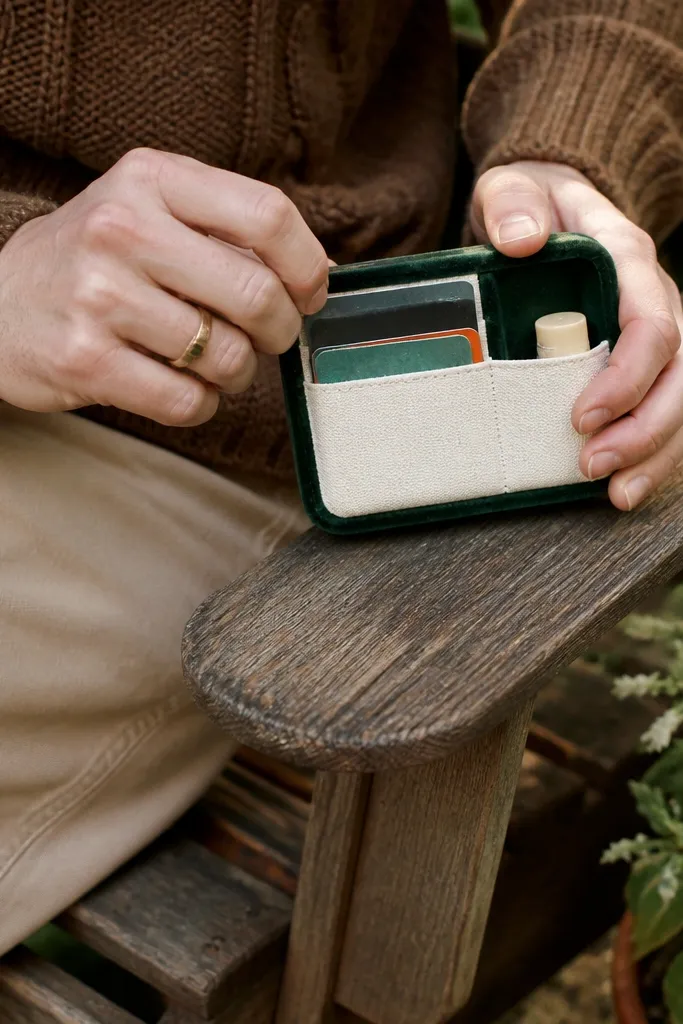 Green velvet Altoids tin wallet with a contrasting pocket panel and snap closure.
