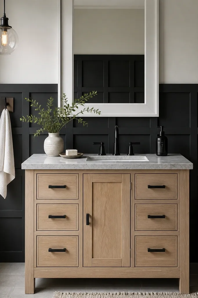 Black square-panel wainscoting with a light top wall and chair rail