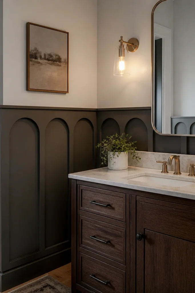 Dark gray wainscoting with arched-top panel openings and light upper wall