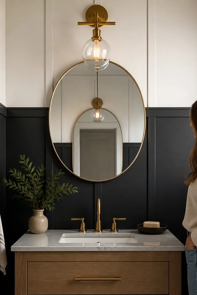 Black vertical-panel wainscoting aligned to a vanity mirror with light upper wall