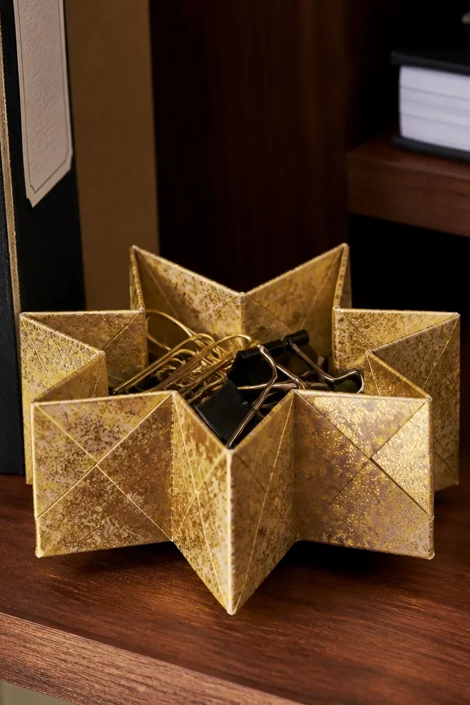 Star-shaped origami box with multiple points in red paper