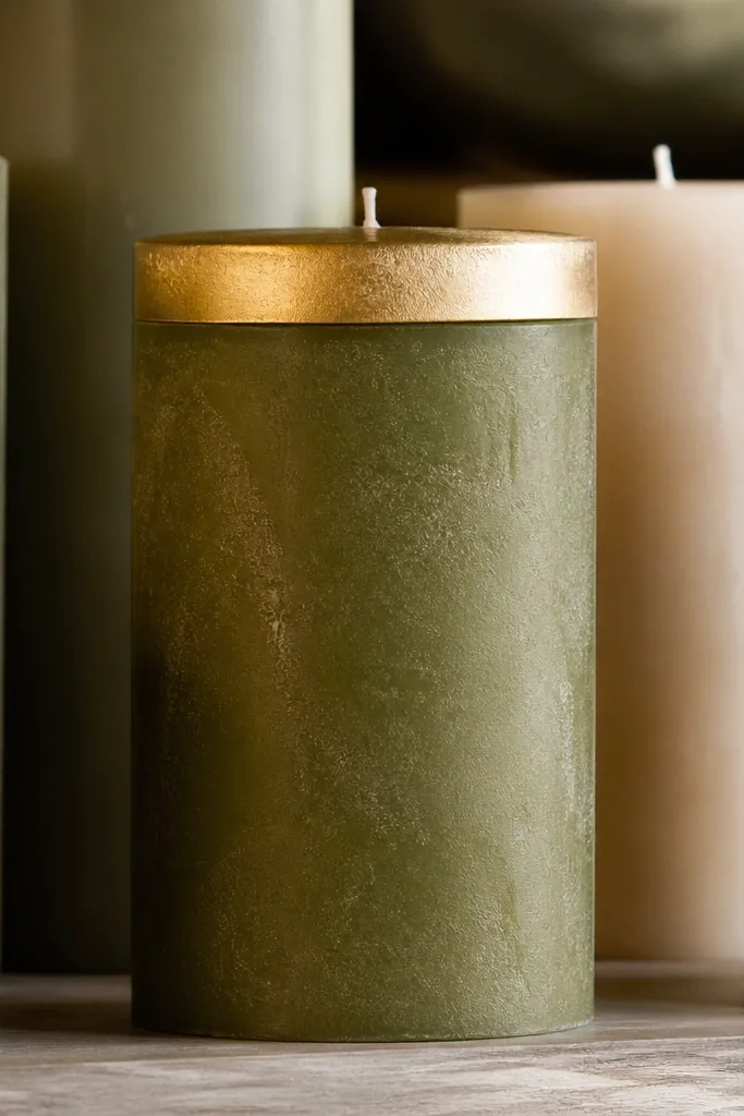 Colored matte candles with a thin gold metallic band at the top edge.