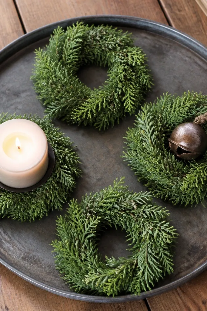 Mini wreath coasters arranged around a candle on a tray